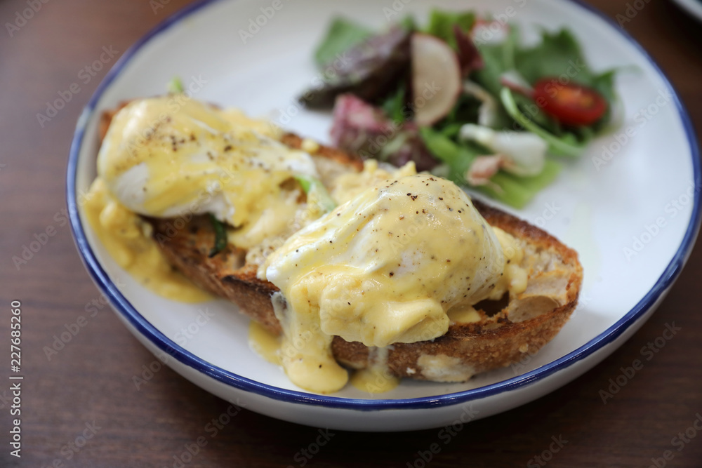 Egg benedict , poached eggs with toast on wood background , English Breakfast Egg benedict , poached eggs with toast on wood background , English Breakfast