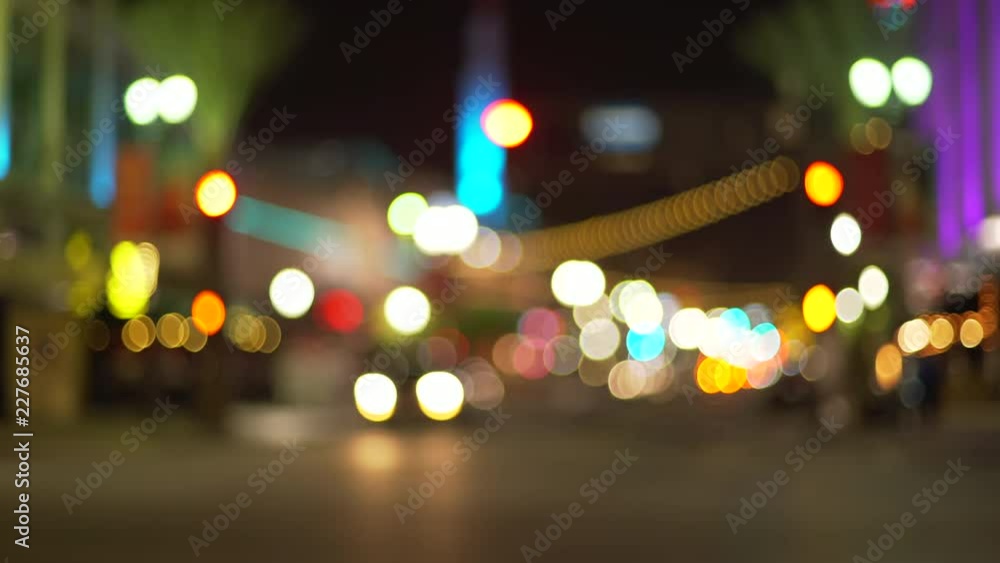 Blurry background plate of city traffic at night with bokeh headlights passing Blurry background plate of city traffic at night with bokeh headlights passing
