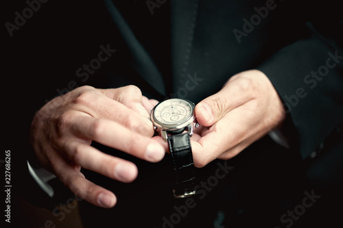 hand holding a watch