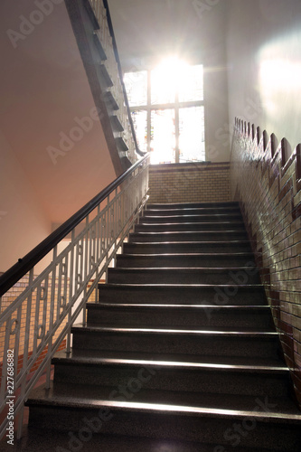 Entrance with a antique stairs and Sunlight shines through the windows and lights in the hallway