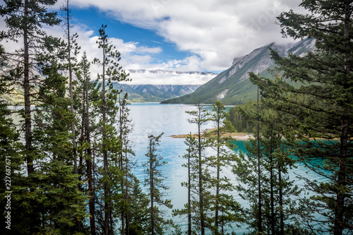 Fototapeta Naklejka Na Ścianę i Meble -  Lake Minnewanka in Banff National Park in the Canadian Rockies - Alberta Canada. Teal color to the water