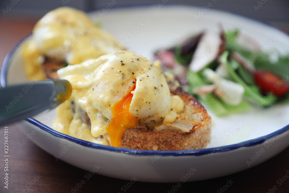 Egg benedict , poached eggs with toast on wood background , English Breakfast Egg benedict , poached eggs with toast on wood background , English Breakfast