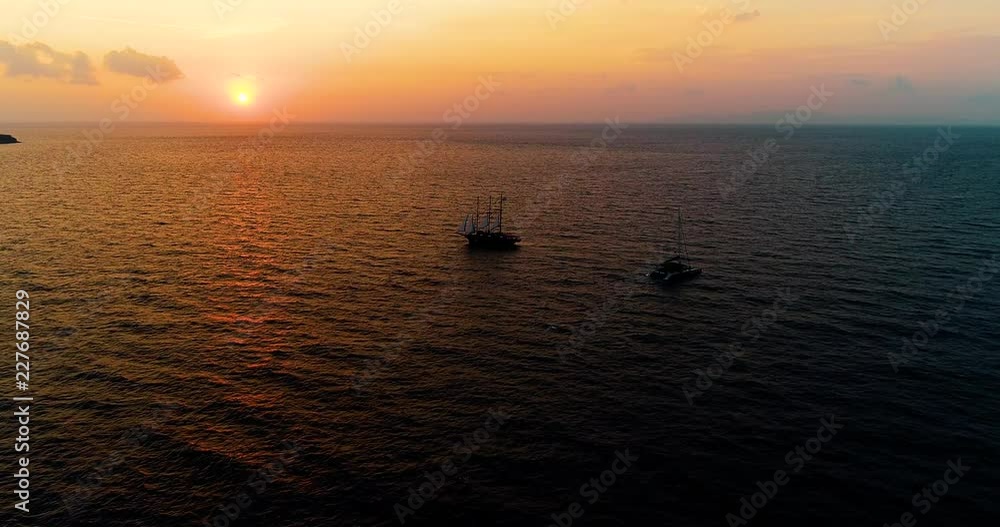 boat in greece in santorini island with sunset boat in greece in santorini island with sunset
