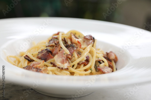 Spaghetti carbonara , Spaghetti white sauce with cheese bacon in outdoor restaurant italian food