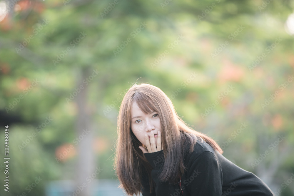Portrait of asian japanese school girl costume looking at park outdoor film vintage style Portrait of asian japanese school girl costume looking at park outdoor film vintage style