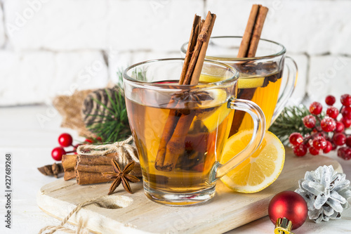 Winter hot tea with lemon and spices