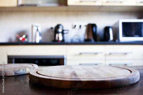 blurred rustic kitchen interior - focus on cutting board