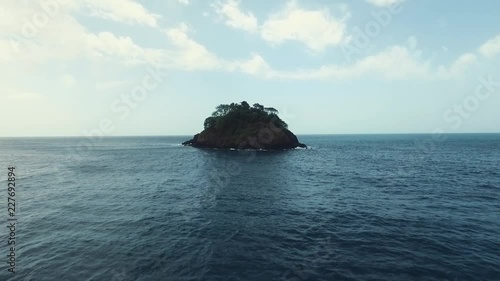 Drone fotoage passing by a lonely island located at one of Panama's caribbean coast photo