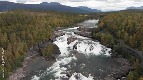 M√•lselvfossen is a powerful waterfall in the north of Norway near Bardufoss in the region Troms. The river M√•lselva drops down over 10 meters, in two steps, with a great power. photo