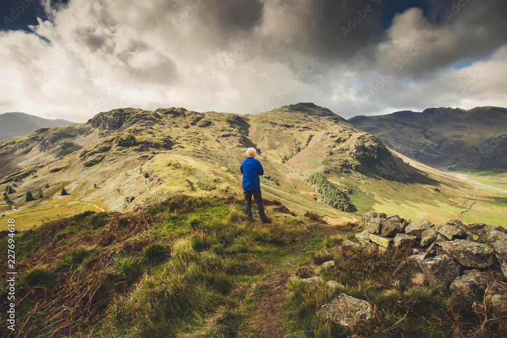 Old man looking at a mountain view