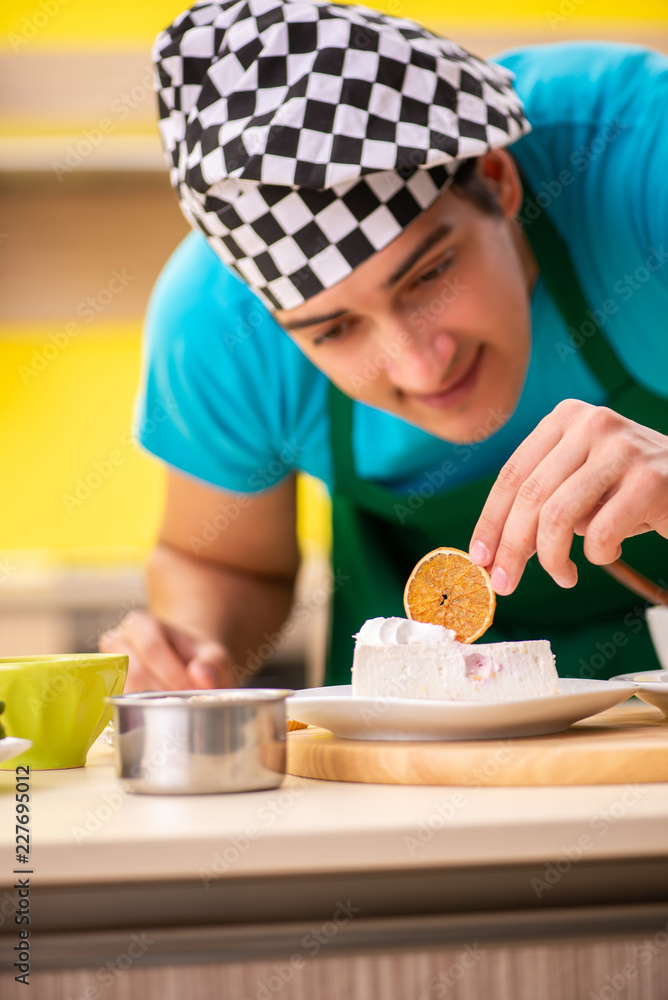 Man cook preparing cake in kitchen at home Man cook preparing cake in kitchen at home