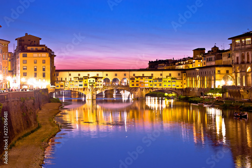 Ponte Vecchio bridge and Arno river waterfront in Florence evening view © xbrchx