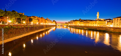 Ponte Vecchio bridge and Arno river waterfront in Florence evening view