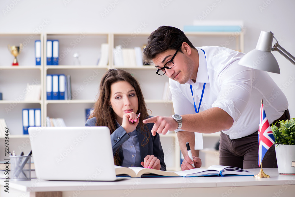 Teacher explaining to student at language training Teacher explaining to student at language training