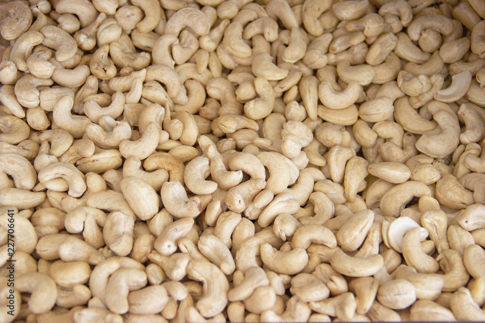Cashews nut background. kernels of peeled nuts Cashews nut background. kernels of peeled nuts