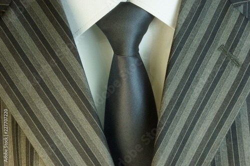 Tie and white shirt and suit, in the wardrobe of men used as decoration, accessory, part of business clothing. Wear to a wedding, prom or graduation.