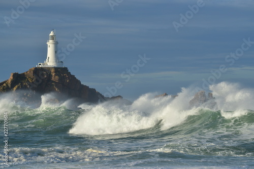 La Corbiere lighthouse, Jersey, U.K. Storm Callum whips up the Atlantic Ocean.