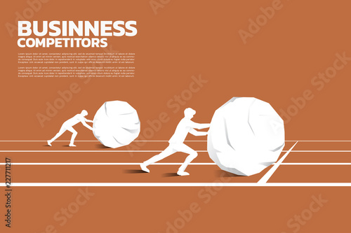 Silhouette of two businessman pushing the big rock on racing track. concept of business challenge and hard work.