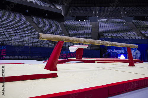 A balance beam in a gymnastic arena 