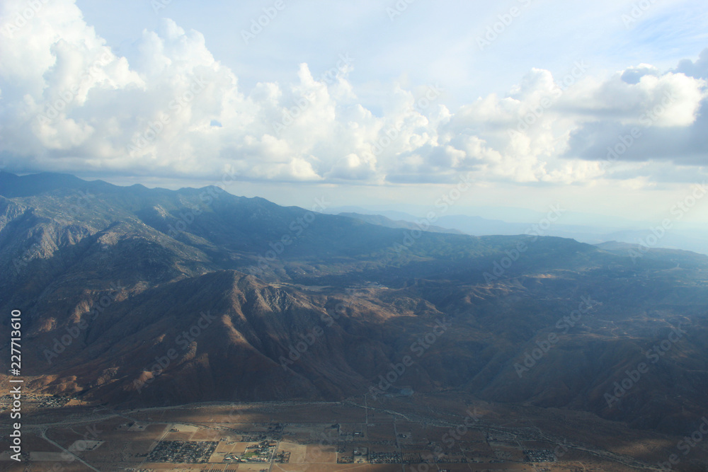 Aerial Desert Mountain Landscape in Rainclouds