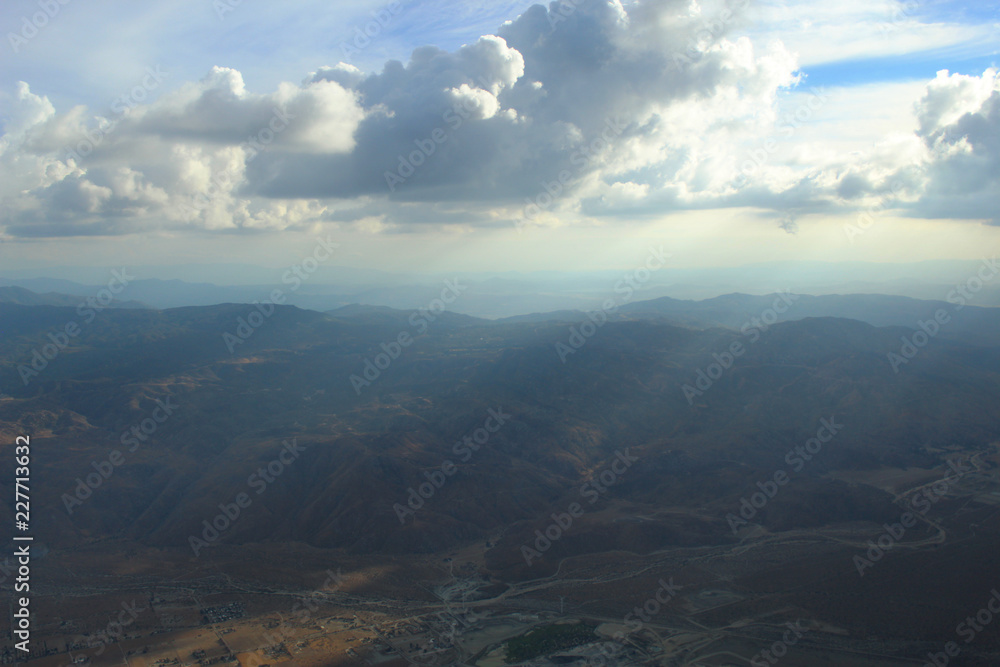 Aerial Clouds over Mountain Range Landscape