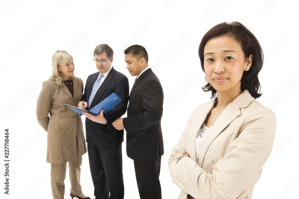 businesswoman with her colleagues in background businesswoman with her colleagues in background