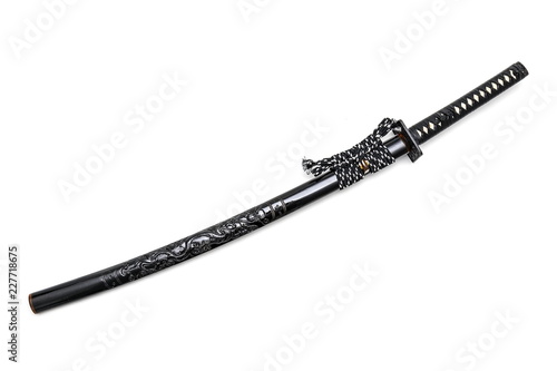 Black Japanese sword and dragon scabbard with steel fitting isolated in white background.
