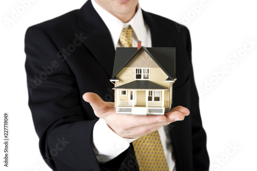 man holding house