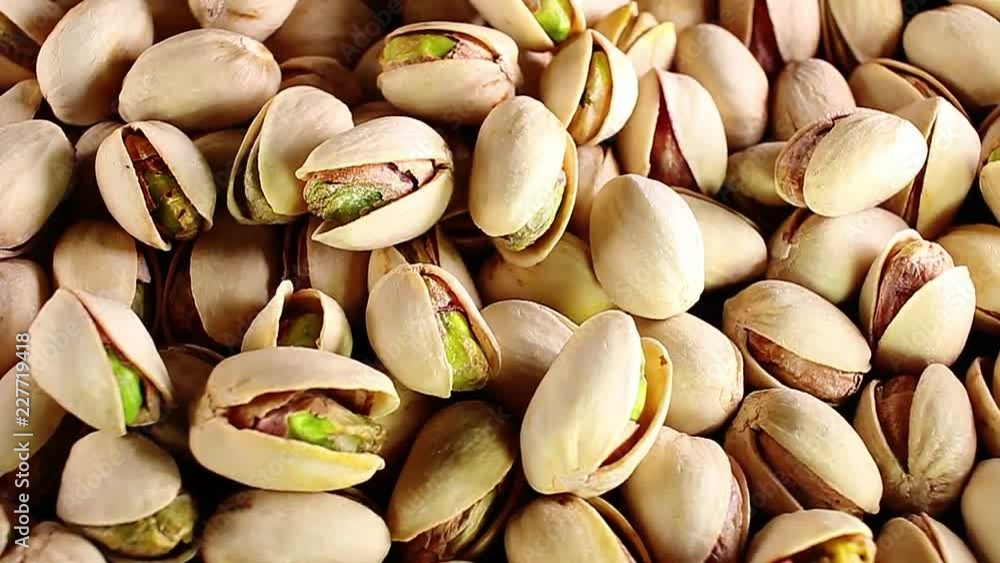 Pistachios. Pistachio texture. Nuts. Green fresh pistachios as texture. Roasted salted pistachios Pistachios. Pistachio texture. Nuts. Green fresh pistachios as texture. Roasted salted pistachios