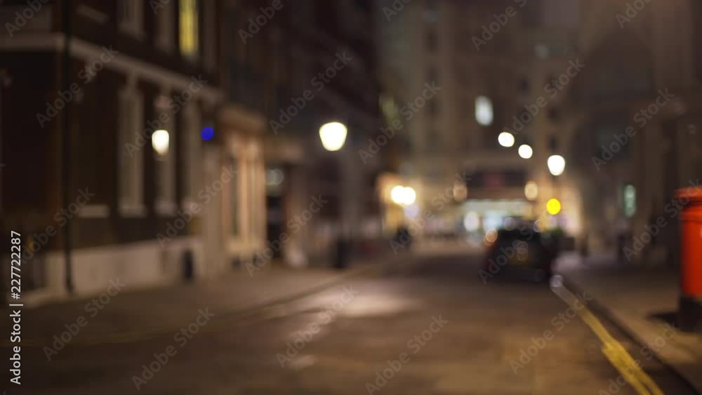 Horizontal pan of dark London street in evening, intended for use as background Horizontal pan of dark London street in evening, intended for use as background