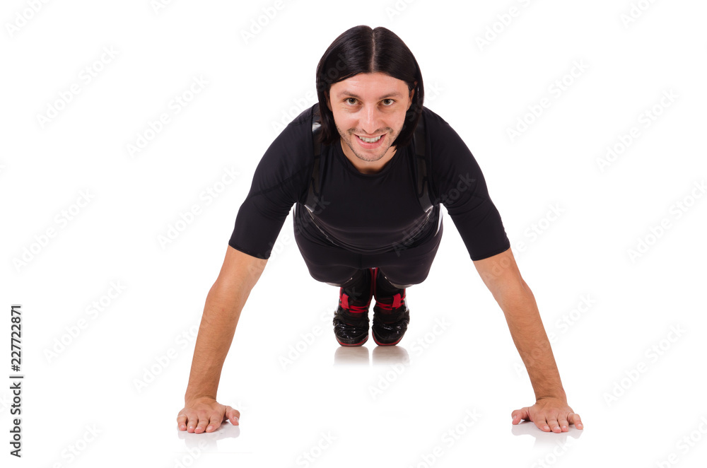 Young man doing exercises isolated on white Young man doing exercises isolated on white
