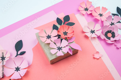 Packing a festive box with ribbons and flowers
