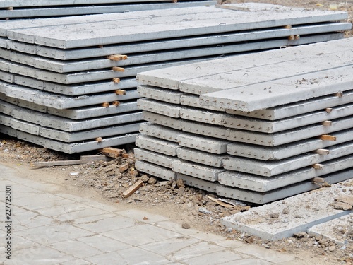 Prestressed Floor planks stacked for construction. It is a slab of reinforced concrete. Put together Structural Topping (concrete composite topping) will work in the same with the finished floor.