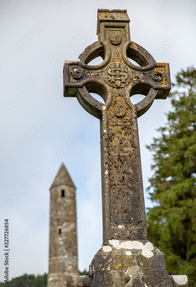 Celtic Cross with Tower in Background Celtic Cross with Tower in Background
