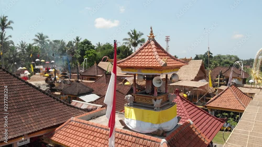 4K aerial flying video of waving Indonesian national in balinese village during big celebration. Bali island, Indonesia. 4K aerial flying video of waving Indonesian national in balinese village during big celebration. Bali island, Indonesia.