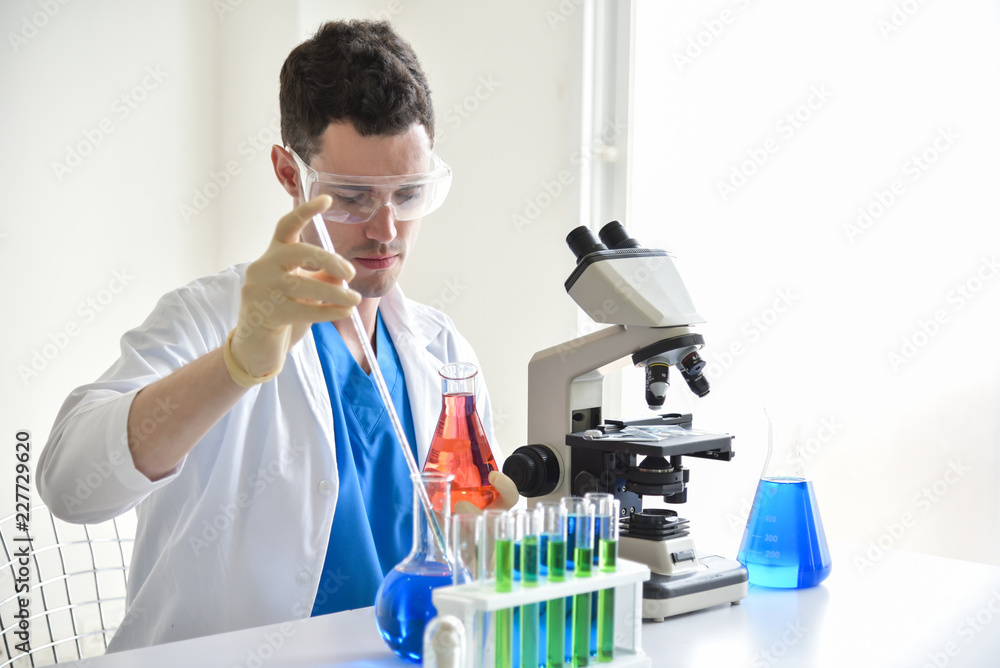 Research Scientist is Using Micropipette Filling Test Tubes.
