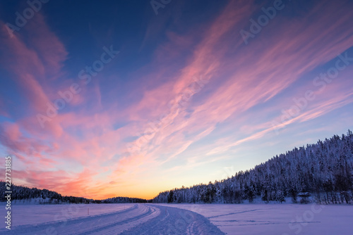 Background with beautiful pink sunset in Lapland © Olha