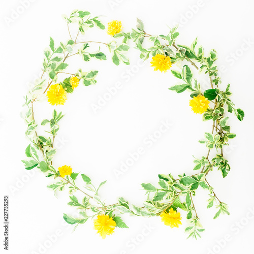 Wreath floral frame of yellow flowers on white background. Flat lay, top view.