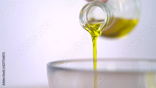 Pouring Olive Oil. Organic oil kitchen ingredients. Essential Oils. Loop