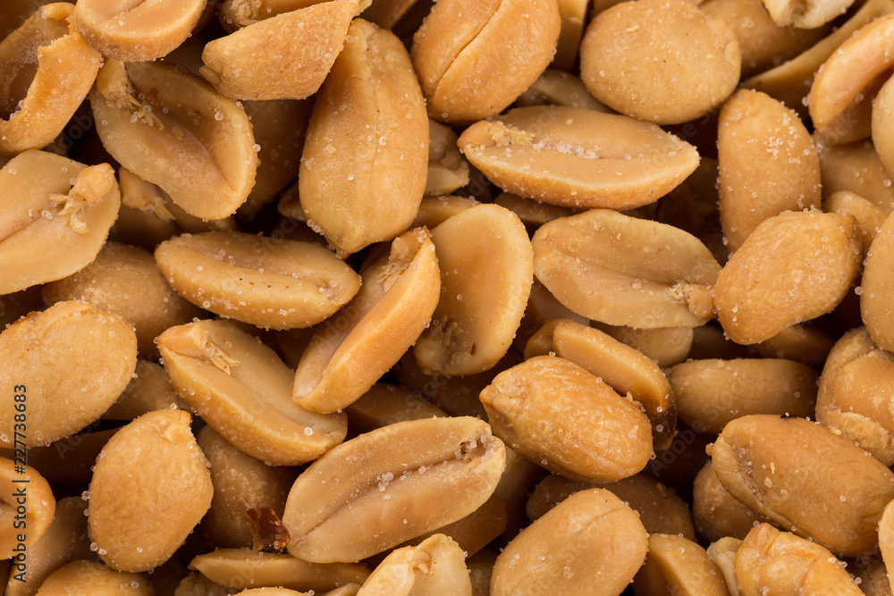 large amount of peeled salted peanuts large amount of peeled salted peanuts