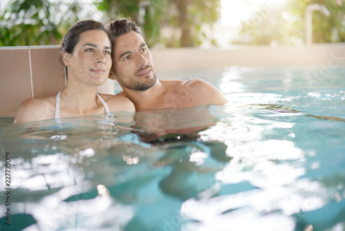 Couple relaxing in spa resort pool