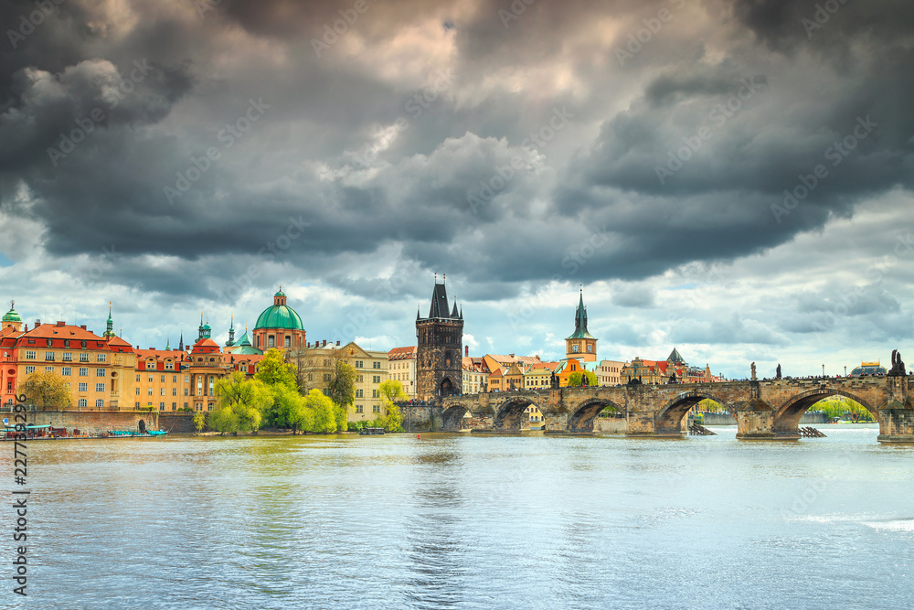 Magical cloudy sky and colorful buildings in Prague, Czech Republic