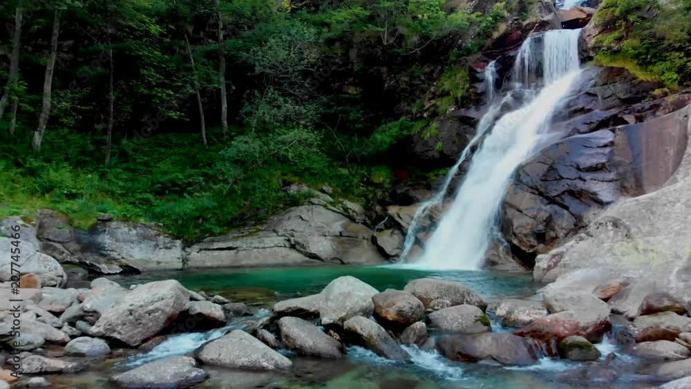 view to amasing waterfall in mountains