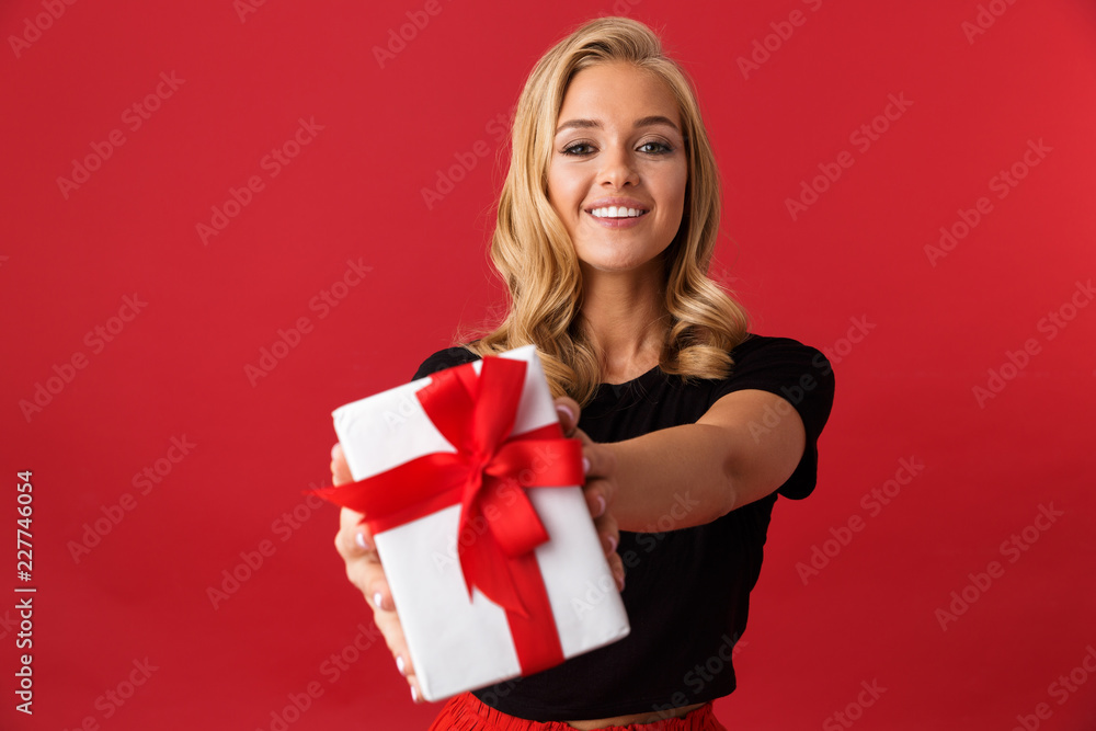 Portrait of a happy young woman isolated over red Portrait of a happy young woman isolated over red