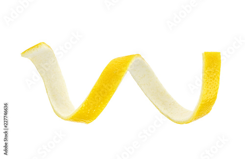 Lemon skin is twisted in a spiral isolated on white background