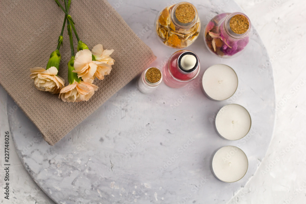 spa set, bottles , candles and flowers top view marble background copy space spa set, bottles , candles and flowers top view marble background copy space