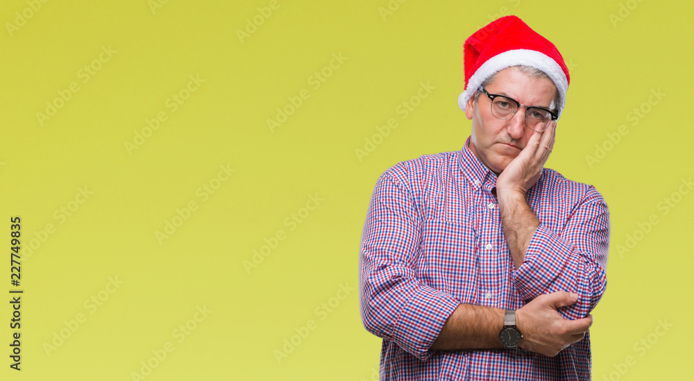 Handsome senior man wearing christmas hat over isolated background thinking looking tired and bored with depression problems with crossed arms. Handsome senior man wearing christmas hat over isolated background thinking looking tired and bored with depression problems with crossed arms.