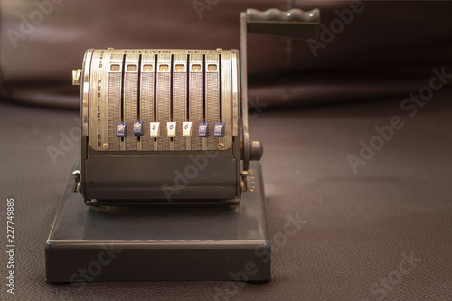 Close up shot of a antique 1950`s Vintage Checkwriter, vintage concept. photo