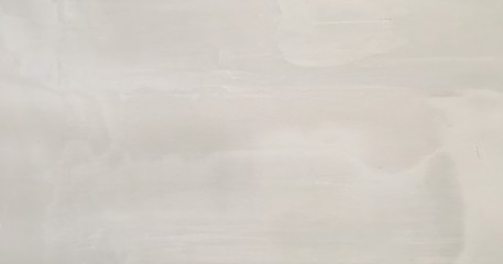 White washed painted textured abstract background with brush strokes in white and black shades. Abstract painting art backgrounds. Hand-painted texture.