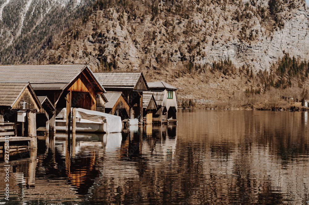 Calm lake and wooden houses on the border